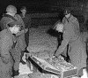 Generals Dwight D. Eisenhower and Omar N. Bradley examine Nazi loot, gold